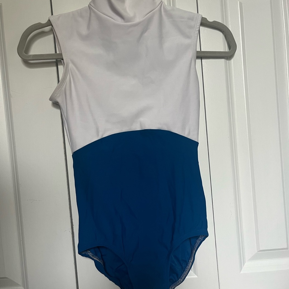 Chic Lucky Leo. Mock neck blue and white color block leotard . Size M
